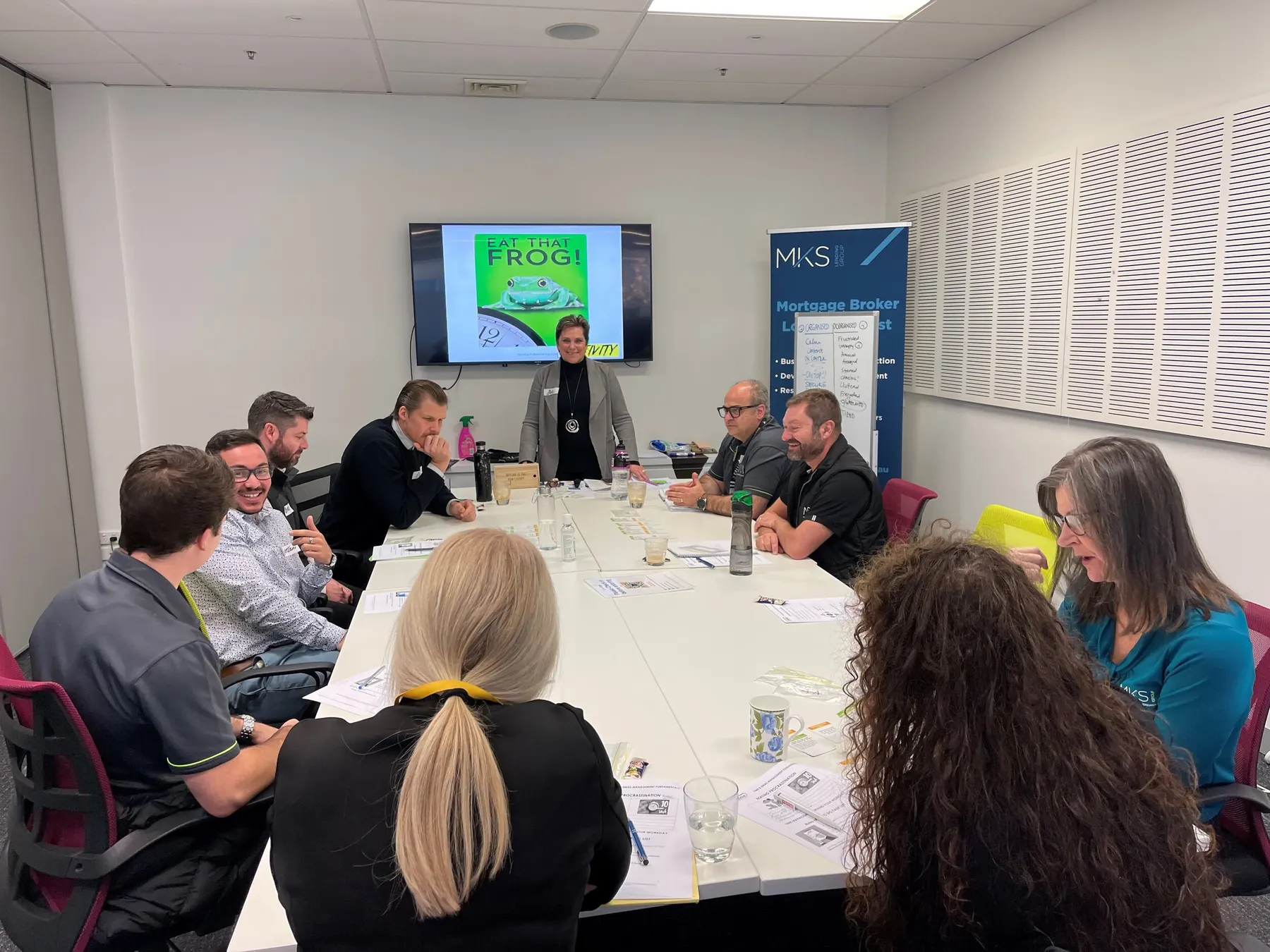Sue running a time management session for the MKS Accounting team around a boardroom table
