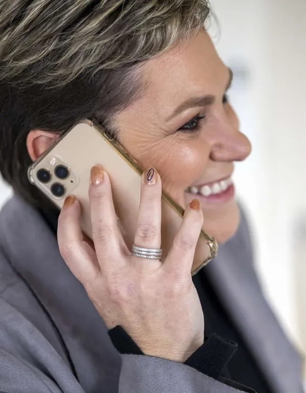 Sue laughing on the phone